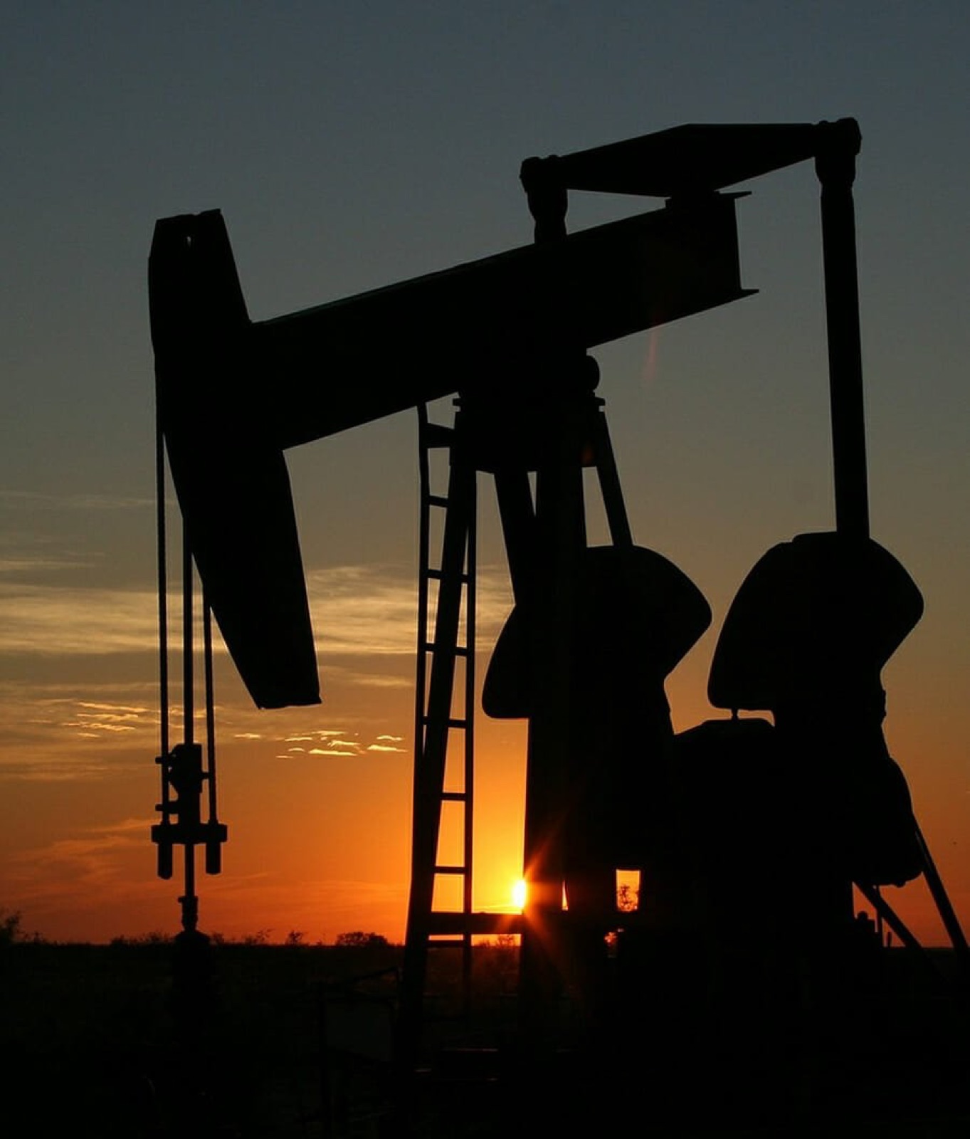 Pumpjack silhouetted against a North Dakota sunset